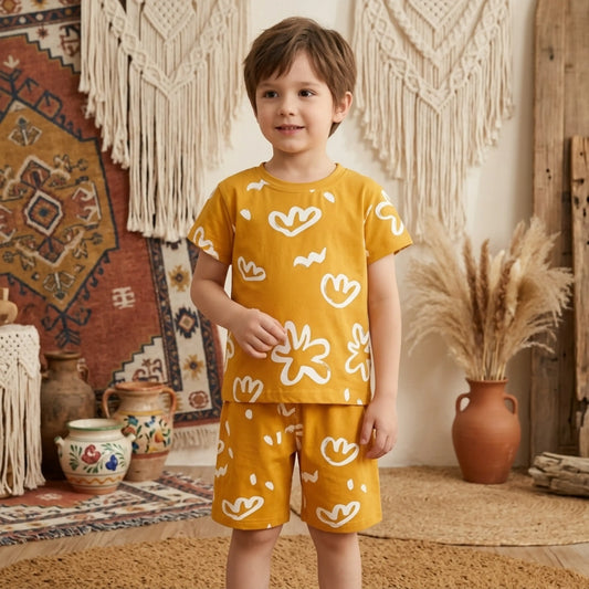 A Boy wearing a summer top and shorts with pattern design.