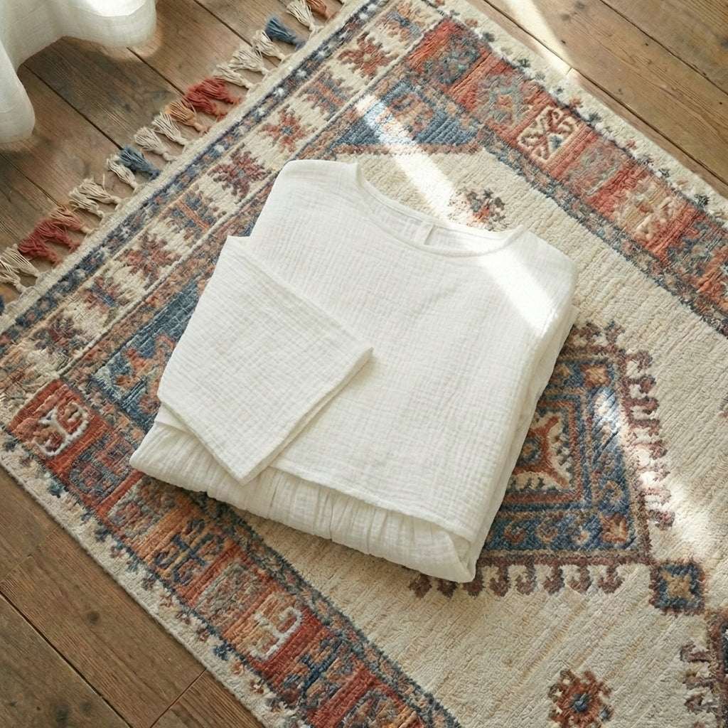 Women’s two-piece lounge set in soft pure cotton, featuring an oversized long-sleeve button-down shirt and matching wide-leg trousers in [Insert Color].