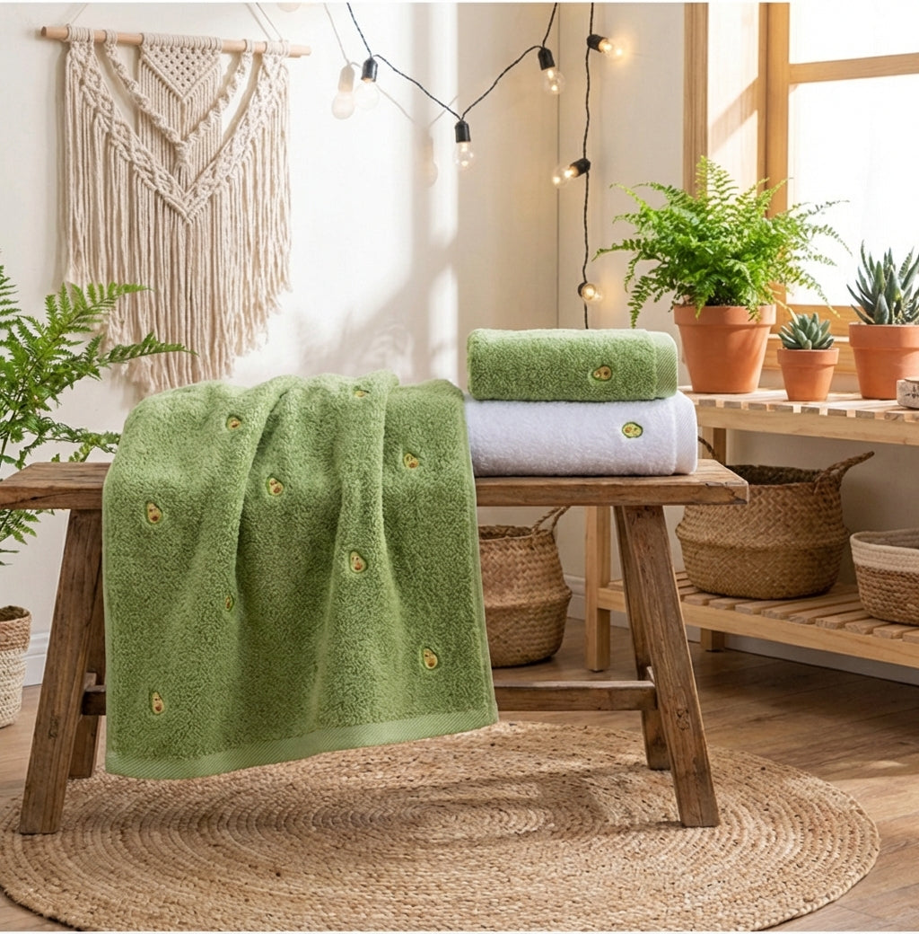 A plush, high-absorbency bath towel made of 100% pure cotton, featuring a classic ribbed border design and soft terry cloth texture.